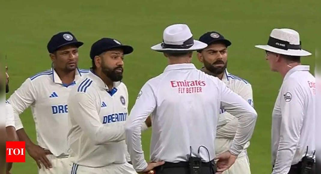 Tensions flare as Rohit Sharma, Virat Kohli engage in heated argument with umpires over bad light decision. Watch | Cricket News Tensions flare as Rohit Sharma, Virat Kohli engage in heated argument with umpires over bad light decision. Watch | Cricket News