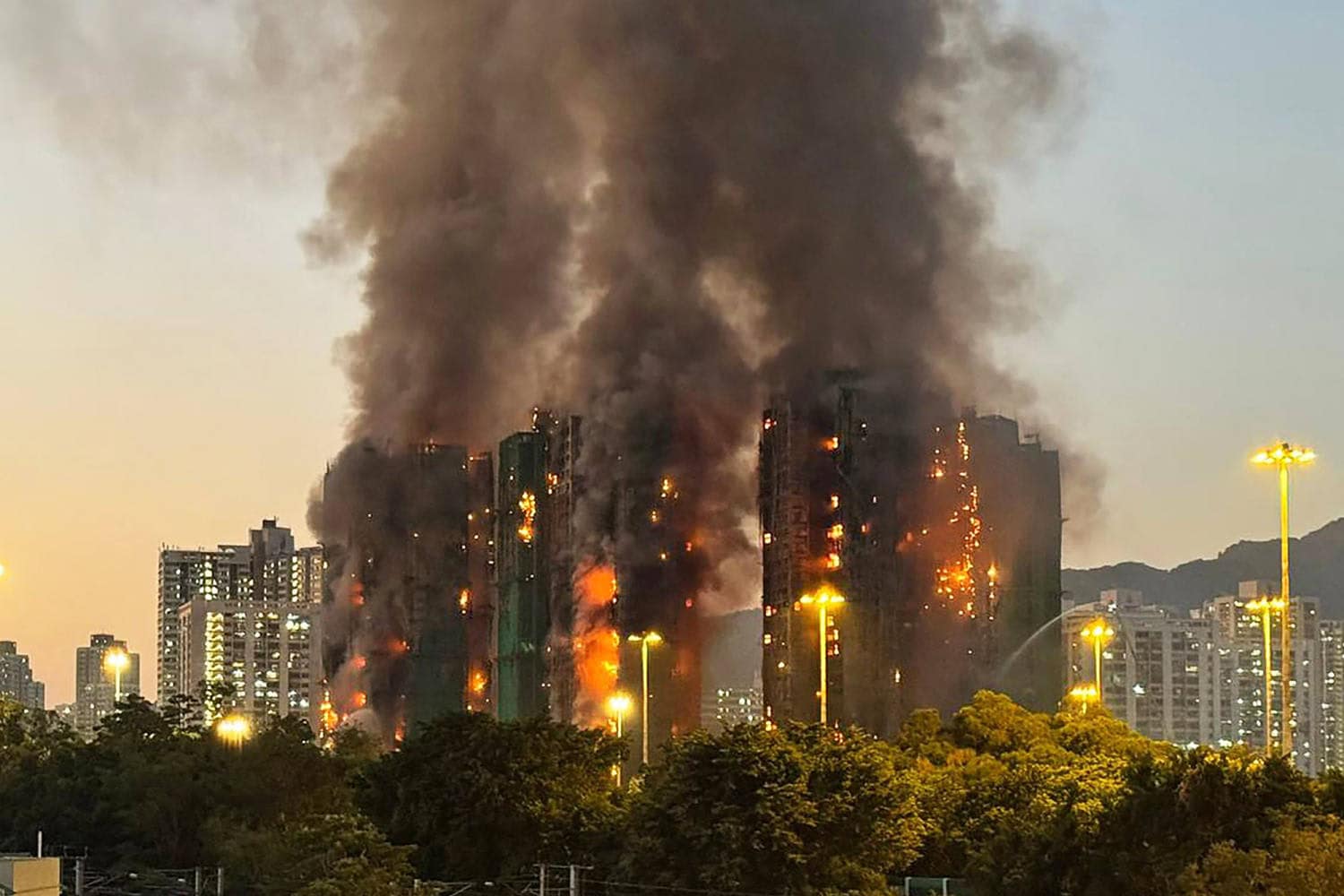 Fire engulfs high-rise housing estate, killing at least 13 in Hong Kong Fire engulfs high-rise housing estate, killing at least 13 in Hong Kong